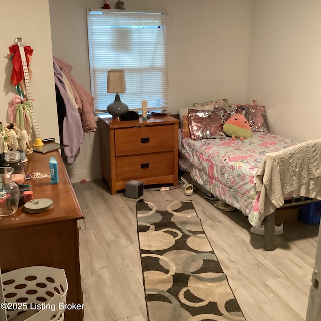bedroom with light wood-style floors