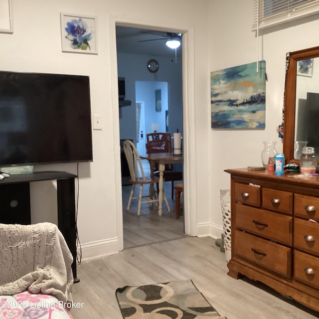 bedroom with baseboards and light wood-type flooring