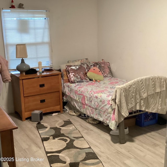 bedroom with light wood-style floors