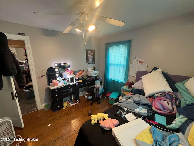 bedroom featuring ceiling fan and dark hardwood / wood-style flooring