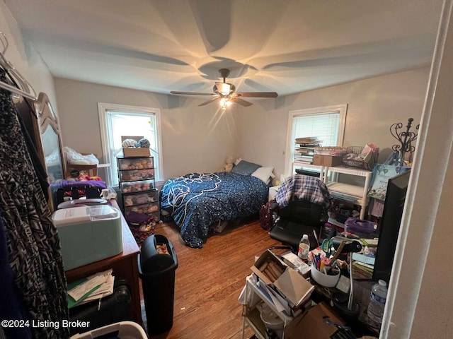 bedroom with ceiling fan and hardwood / wood-style floors