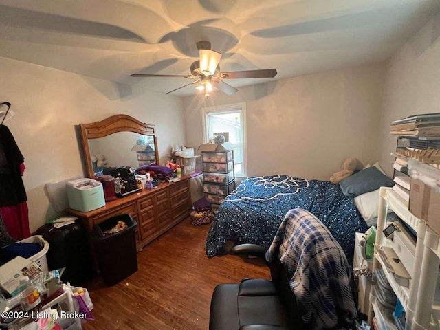 bedroom featuring hardwood / wood-style floors and ceiling fan