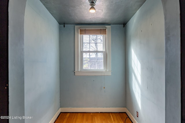 unfurnished room with light wood-type flooring