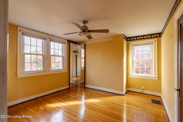 spare room featuring ceiling fan and light wood-type flooring