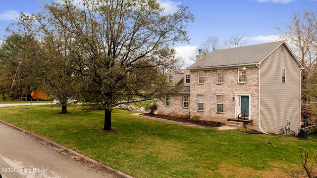 view of front of property with a front lawn