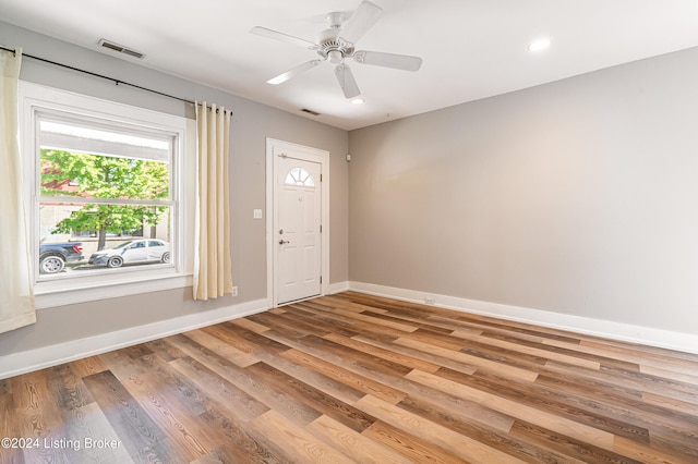 foyer with ceiling fan and hardwood / wood-style flooring