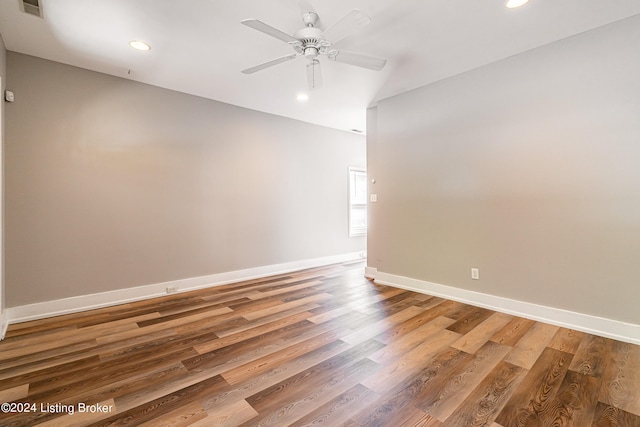 empty room featuring hardwood / wood-style floors and ceiling fan