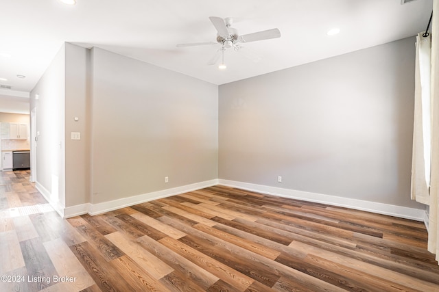 unfurnished room with hardwood / wood-style floors and ceiling fan