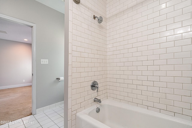 bathroom featuring tile patterned floors and tiled shower / bath