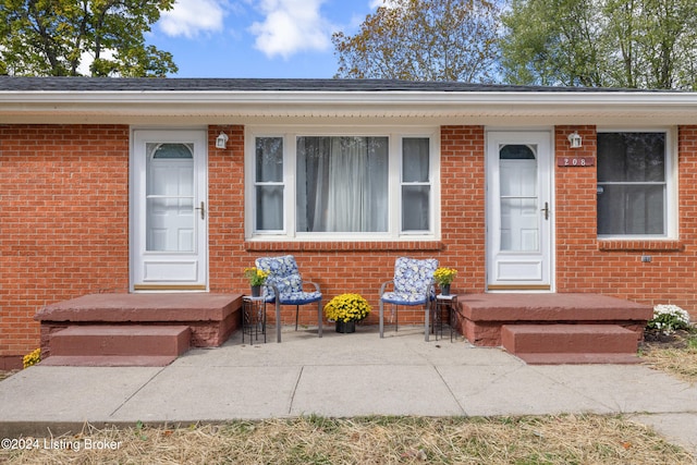 doorway to property featuring a patio area