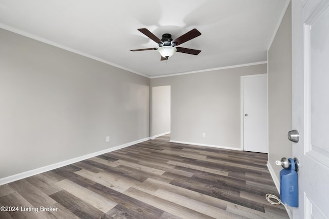 unfurnished room with dark hardwood / wood-style flooring, ceiling fan, and crown molding