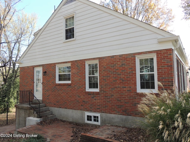 exterior space featuring brick siding