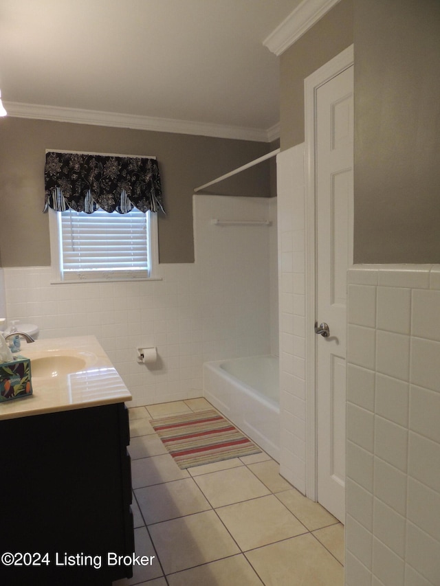 bathroom featuring tile patterned flooring, vanity, tile walls, and crown molding