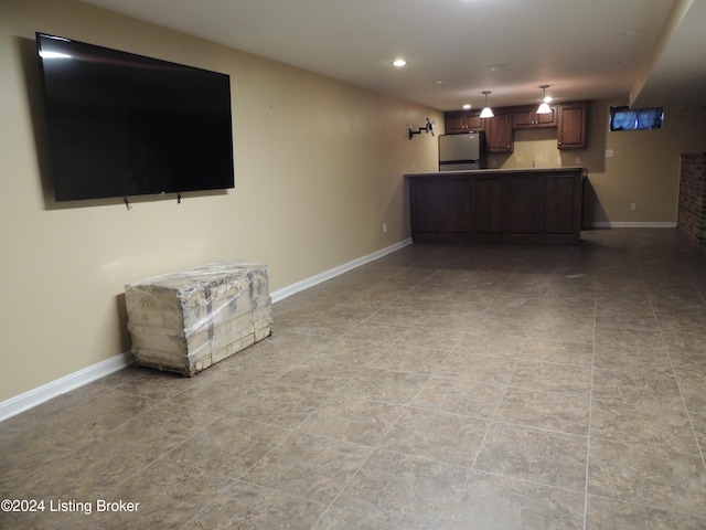 unfurnished living room with light tile patterned flooring