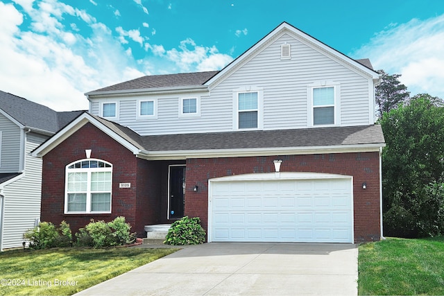 front facade featuring a garage and a front yard