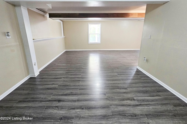 basement featuring dark hardwood / wood-style flooring