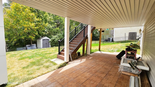 view of patio featuring central AC and a storage unit