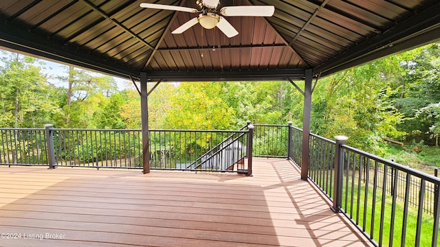 wooden deck with a gazebo and ceiling fan