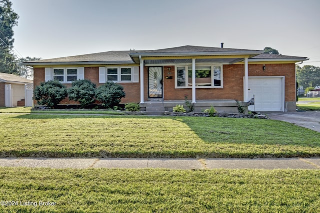 ranch-style home with a front yard, a porch, and a garage