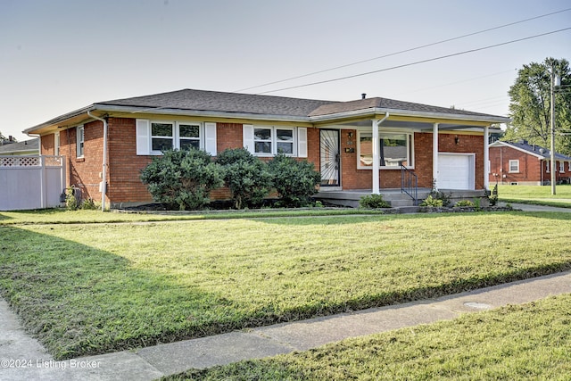 single story home featuring a front lawn