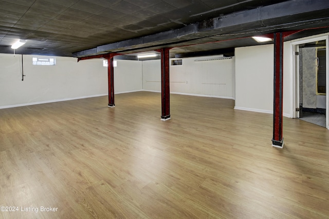 basement with wood-type flooring