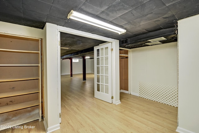 basement featuring light wood-type flooring