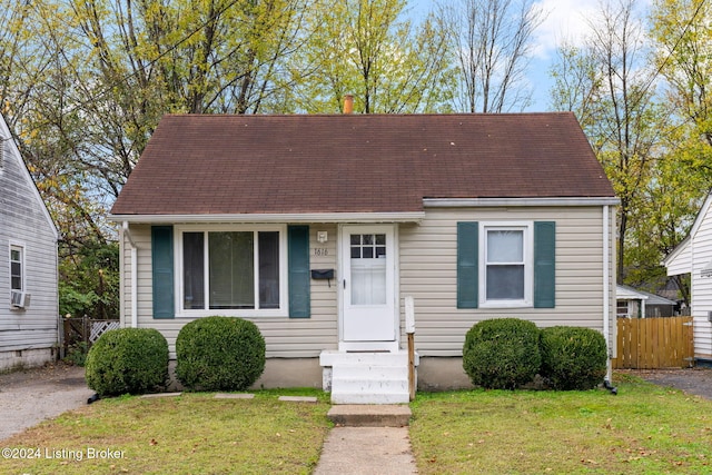 1616 Earl Ave, Louisville, KY 40215 - view of front facade with cooling unit and a front lawn