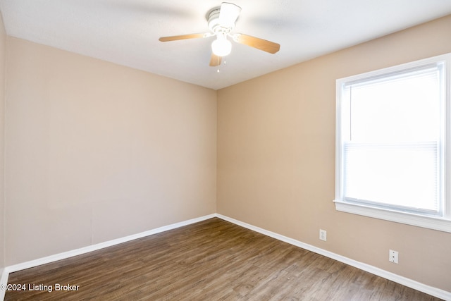 spare room with ceiling fan and hardwood / wood-style flooring