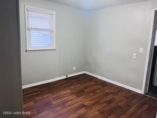 unfurnished room featuring dark hardwood / wood-style floors