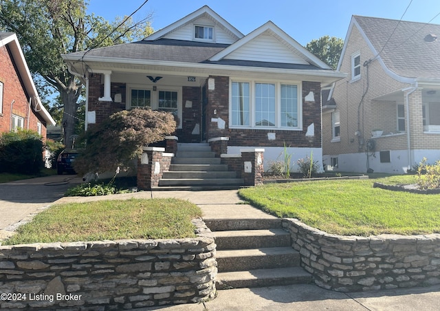 bungalow with a front yard