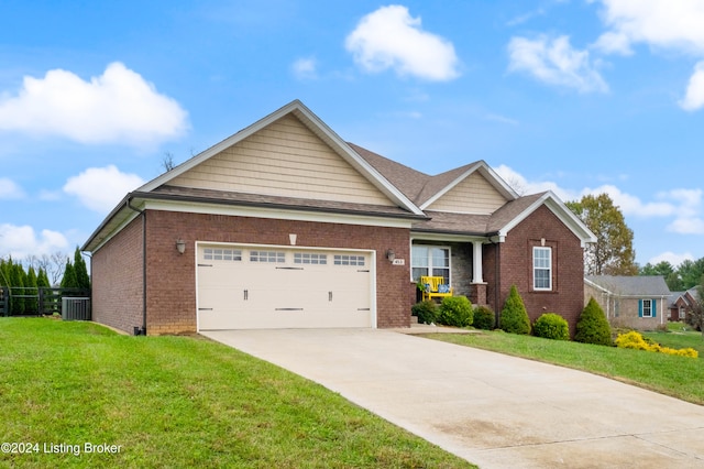 view of front facade featuring a front yard, a garage, and cooling unit