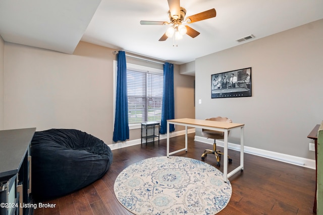 home office with dark hardwood / wood-style floors and ceiling fan