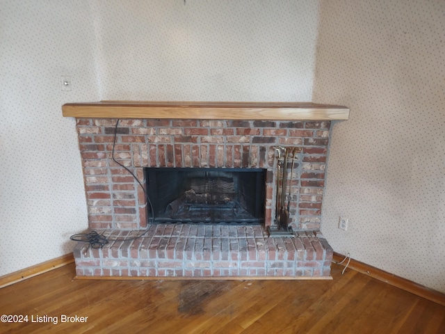 room details with a fireplace and hardwood / wood-style floors