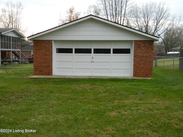 garage featuring a yard