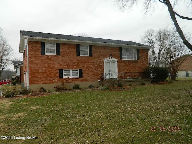 raised ranch featuring a front lawn