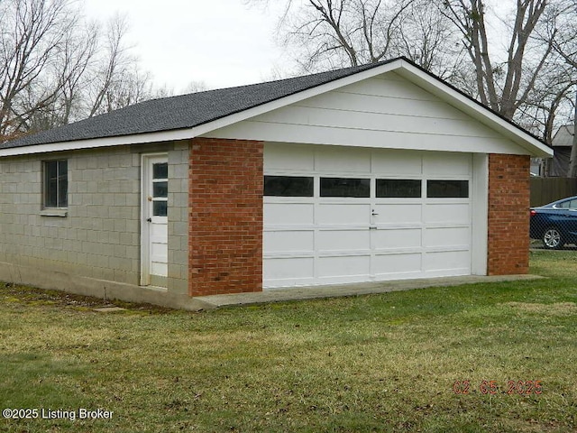 garage featuring a yard