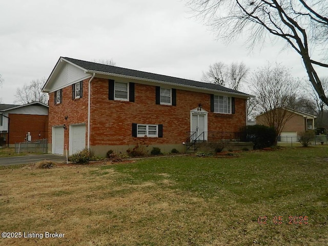 view of front facade featuring a garage and a front lawn