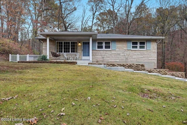 single story home with a porch and a front lawn