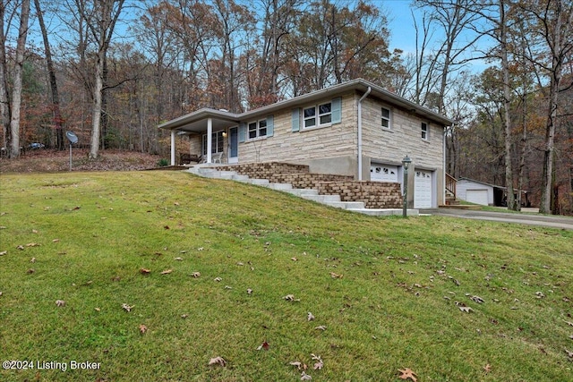 view of front facade with a porch, a front yard, and a garage