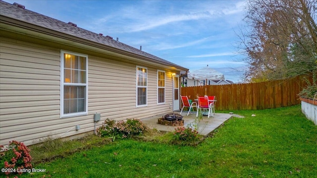 view of yard featuring a patio area and an outdoor fire pit