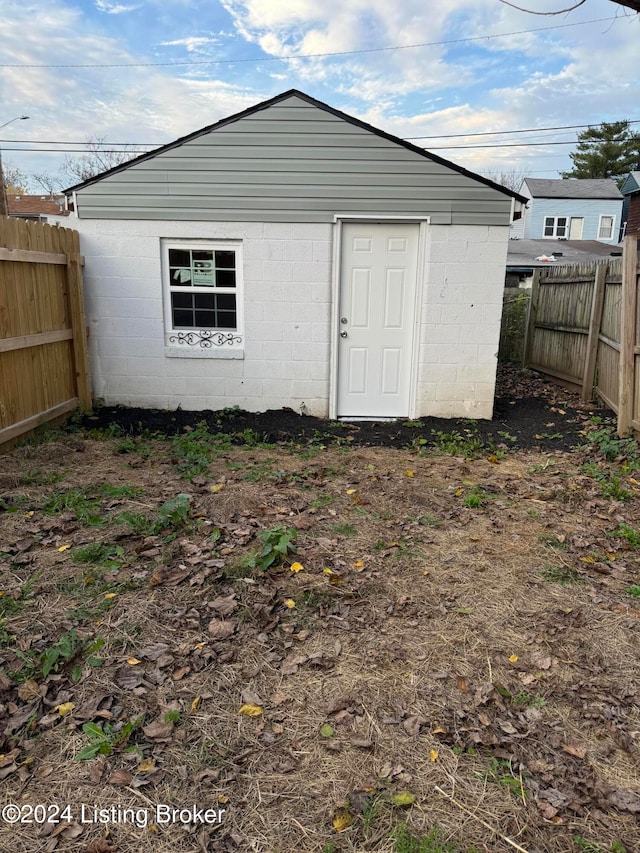 view of outdoor structure with a fenced backyard