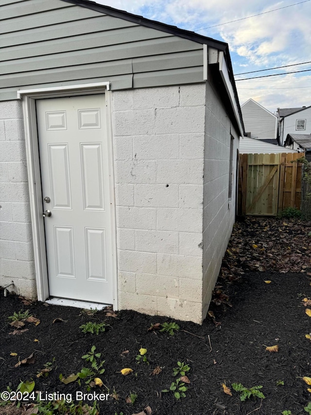 view of outbuilding with fence