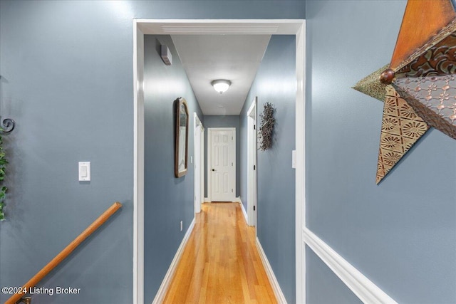 corridor with light wood-type flooring