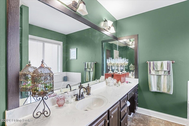 bathroom featuring vanity and a tub to relax in