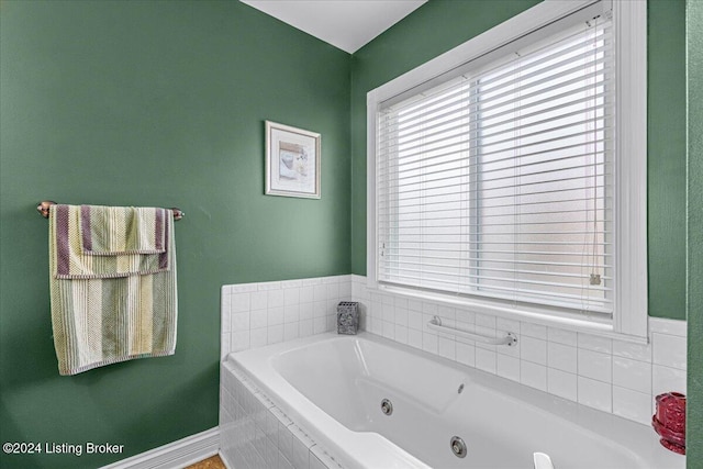 bathroom featuring tiled bath