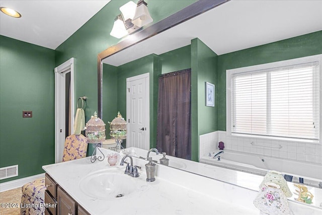 bathroom with vanity and a bathtub