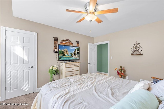 carpeted bedroom featuring ceiling fan