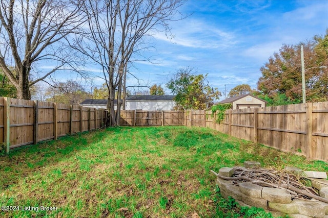 view of yard with an outdoor fire pit