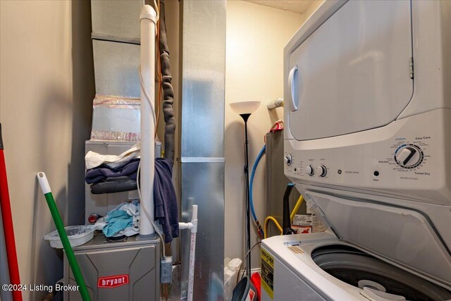 washroom with stacked washer / drying machine