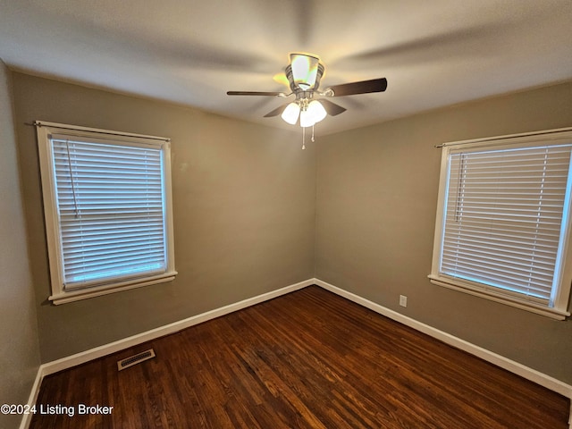 empty room with ceiling fan and hardwood / wood-style floors